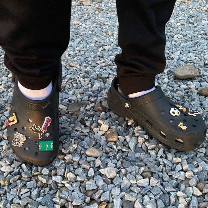 Black Crocs with socks with soccer Jibbitz